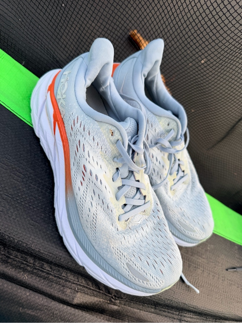 Hoka Clinton 8 Women's Light Blue Running Shoes with Orange Accent